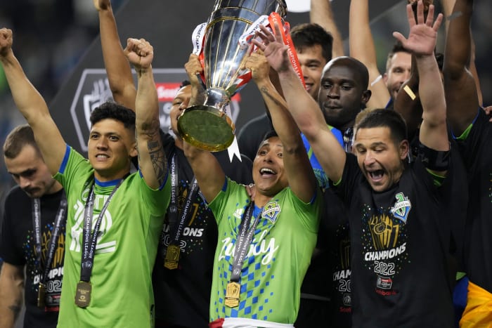 Seattle Sounders striker Raul Ruidiaz pictured lifting the CONCACAF Champions League trophy after scoring twice in a 3-0 win over Pumas